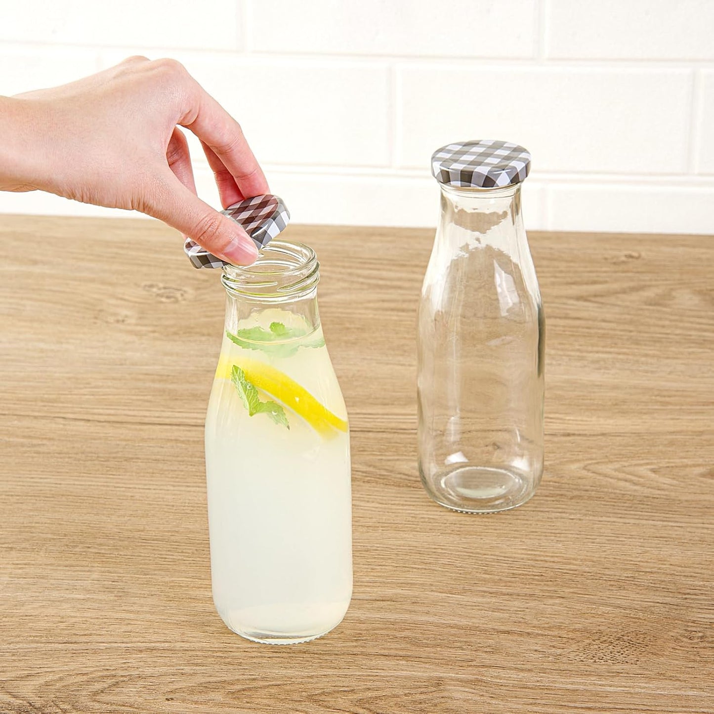 Restaurantware French Countryside 15 Ounce Glass Bottles 10 Durable Juice Bottles - With Black Plaid Lid Dishwashable Clear Glass Countryside Bottles For Hot And Cold Beverages