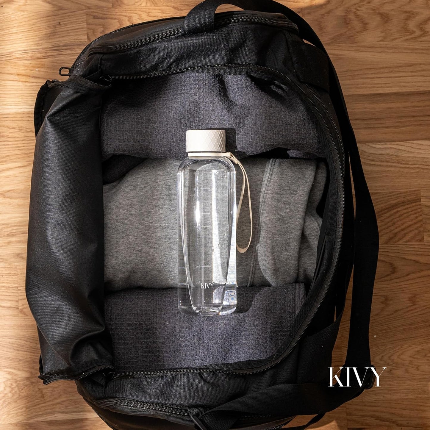 KIVY Slim Water Bottle 22oz [Lightweight & Shatterproof] - Small Drinking Waterbottle - Clear Water Bottle Without Straw for School, Sport & Travel - Transparent Bottle Dishwasher Safe, BPA Free
